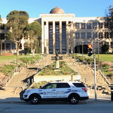 Police vehicle in front of CCSF Science Hall